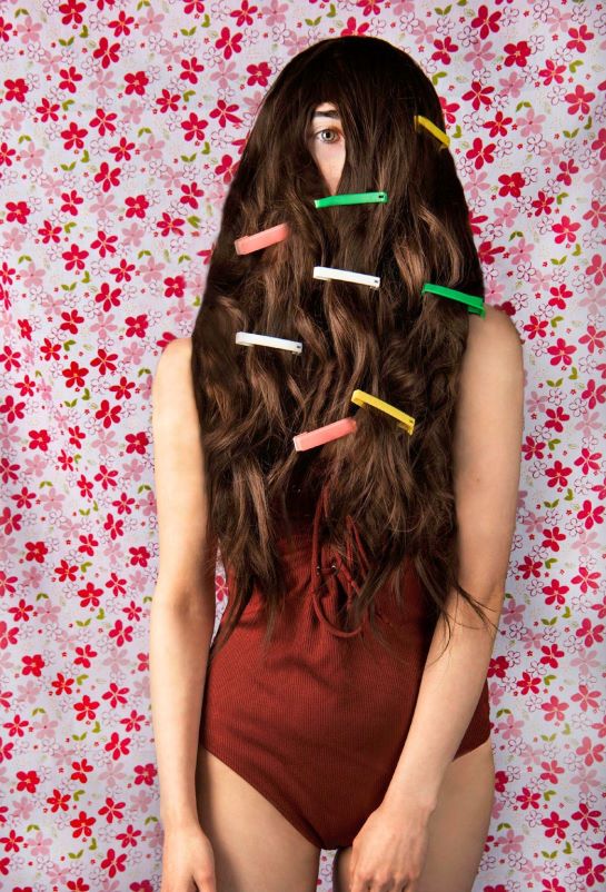 Student with coloured clips in her long brown hair